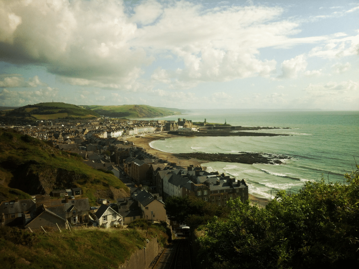 A daytime view of Aberystwyth and Cardigan Bay from a raised position