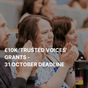 A graphic showing a woman applauding.