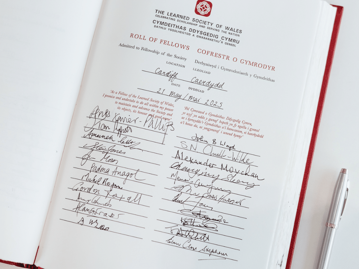 A page from the Learned Society of Wales Roll of Fellows with multiple signatures.